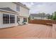 Backyard with wooden deck and small patio at 1130 Laurel Cove Dr, Snellville, GA 30078