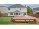 Large backyard featuring a wooden deck and fenced lawn at 1130 Laurel Cove Dr, Snellville, GA 30078