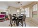Bright dining area features a square table, 4 chairs, and natural light at 1130 Laurel Cove Dr, Snellville, GA 30078