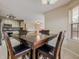 Bright dining area features a square table, 4 chairs, and natural light into the kitchen area at 1130 Laurel Cove Dr, Snellville, GA 30078