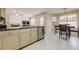 Open kitchen flows into breakfast nook, featuring stainless appliances, and view to living area at 1130 Laurel Cove Dr, Snellville, GA 30078