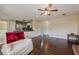 Bright living room offering seamless flow to the kitchen with stainless steel appliances at 1130 Laurel Cove Dr, Snellville, GA 30078