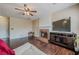 Comfortable living room with fireplace, tv, and hardwood floors at 1130 Laurel Cove Dr, Snellville, GA 30078