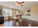 Open-concept living room with hardwood floors that flows into the kitchen and dining areas at 1130 Laurel Cove Dr, Snellville, GA 30078