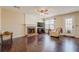 Inviting living room featuring a fireplace and elegant dark wood flooring for a cozy atmosphere at 1130 Laurel Cove Dr, Snellville, GA 30078