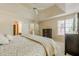 Cozy main bedroom has neutral tones, tray ceilings, and furniture at 1130 Laurel Cove Dr, Snellville, GA 30078