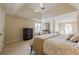 Bright main bedroom features neutral tones, tray ceilings, and ample natural light at 1130 Laurel Cove Dr, Snellville, GA 30078
