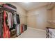 Spacious walk-in closet with built-in shelving and ample storage space at 1130 Laurel Cove Dr, Snellville, GA 30078