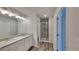 Bright bathroom features dual sinks, granite countertops, vinyl floors, and a glass shower at 18 Loth Wages (Lot 18) Rd, Dacula, GA 30019