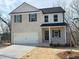 Charming two-story home with a brick facade and a two-car garage at 18 Loth Wages (Lot 18) Rd, Dacula, GA 30019