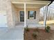 Inviting front porch with decorative accents and well-maintained landscaping at 18 Loth Wages (Lot 18) Rd, Dacula, GA 30019