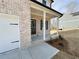 Charming front porch with white columns and landscaped garden at 18 Loth Wages (Lot 18) Rd, Dacula, GA 30019