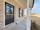 Close-up of front entrance with brick columns and covered porch at 18 Loth Wages (Lot 18) Rd, Dacula, GA 30019