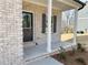 Inviting front porch with brick columns and a view of the landscaped yard at 18 Loth Wages (Lot 18) Rd, Dacula, GA 30019