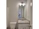 This bathroom features granite countertops and a decorative light fixture at 2 Loth Wages (Lot 2) Rd, Dacula, GA 30019