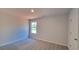 Bedroom featuring neutral carpet, white walls, a window, and a closet at 2 Loth Wages (Lot 2) Rd, Dacula, GA 30019