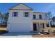 Charming two-story home with white siding, grey shutters, attached garage, and a well-manicured lawn at 2 Loth Wages (Lot 2) Rd, Dacula, GA 30019