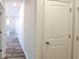 Hallway with access to various rooms featuring wood floors and neutral wall color at 2 Loth Wages (Lot 2) Rd, Dacula, GA 30019