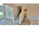 Hallway with staircase leading upstairs, view of bathroom, and access to the kitchen at 2 Loth Wages (Lot 2) Rd, Dacula, GA 30019