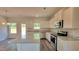 Bright kitchen with granite countertops, stainless appliances, modern cabinets and a center island at 2 Loth Wages (Lot 2) Rd, Dacula, GA 30019