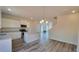 An open kitchen with white cabinets, stainless steel appliances, and a center island at 2 Loth Wages (Lot 2) Rd, Dacula, GA 30019