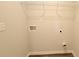Laundry room with white wire shelving, new connections, and neutral walls at 2 Loth Wages (Lot 2) Rd, Dacula, GA 30019