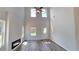 Spacious living room featuring vaulted ceilings, modern fireplace and wood floors, filled with natural light at 2 Loth Wages (Lot 2) Rd, Dacula, GA 30019