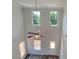 Bright living room featuring hardwood floors, a ceiling fan, and lots of windows at 2 Loth Wages (Lot 2) Rd, Dacula, GA 30019