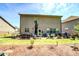 Expansive backyard featuring a patio with outdoor seating, BBQ grill, and lush lawn for entertaining and relaxation at 345 Piedmont Cir, Covington, GA 30016