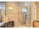 Modern bathroom with a glass shower, tiled walls, and decorative wooden towel ladder at 345 Piedmont Cir, Covington, GA 30016