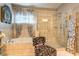 Bathroom with a garden tub, a tiled shower, and a zebra print chair at 345 Piedmont Cir, Covington, GA 30016
