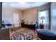 Cozy bedroom featuring a plush sofa, stylish rug, and ambient lighting at 345 Piedmont Cir, Covington, GA 30016