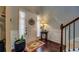 Welcoming entryway with decorative rug, charming decor, and staircase at 345 Piedmont Cir, Covington, GA 30016