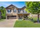 Charming two-story home with a landscaped yard, inviting front porch and a two car garage at 345 Piedmont Cir, Covington, GA 30016