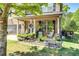 Inviting front porch decorated with potted plants and comfortable seating, perfect for relaxation at 345 Piedmont Cir, Covington, GA 30016