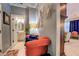 Hallway seating area leading to a bathroom with stylish fixtures and design accents at 345 Piedmont Cir, Covington, GA 30016