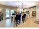 Bright kitchen featuring a granite island and stainless steel appliances at 345 Piedmont Cir, Covington, GA 30016