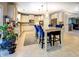 Open kitchen with island seating and access to the living room at 345 Piedmont Cir, Covington, GA 30016