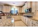 Modern kitchen with granite countertops, stainless steel appliances, and lots of cabinetry at 345 Piedmont Cir, Covington, GA 30016