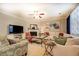 Comfortable living area with soft seating, fireplace, and a large screen television at 345 Piedmont Cir, Covington, GA 30016