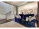 Inviting living room with stairs, elegant molding and plush blue seating at 345 Piedmont Cir, Covington, GA 30016