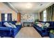Cozy living room featuring plush blue sofas, elegant decor, and soft natural light at 345 Piedmont Cir, Covington, GA 30016
