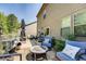 Backyard patio featuring a seating area, grill, landscaping, and lots of sun at 345 Piedmont Cir, Covington, GA 30016