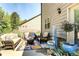 Outdoor patio with comfortable seating area, landscaping, and peaceful outdoor atmosphere at 345 Piedmont Cir, Covington, GA 30016