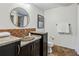Unique bathroom featuring colorful sink, decorative mirror, tiled countertop, and ample counterspace at 901 United Se Ave, Atlanta, GA 30316