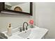 Bright bathroom featuring a decorative mirror, a modern faucet, and a stylish white sink at 901 United Se Ave, Atlanta, GA 30316