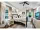 Cozy bedroom with neutral tones, soft lighting, hardwood floors, and a comfortable bed at 901 United Se Ave, Atlanta, GA 30316