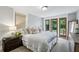 Serene bedroom with french doors to the garden, complemented by a comfortable queen size bed at 901 United Se Ave, Atlanta, GA 30316