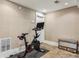This exercise room features an exercise bicycle and exposed-aggregate concrete floors at 901 United Se Ave, Atlanta, GA 30316