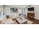 Comfortable living room with a large sectional sofa, wooden coffee table, and modern art at 901 United Se Ave, Atlanta, GA 30316